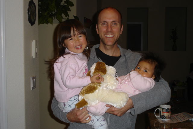 Here is John with his lovely daughters: